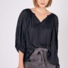 A woman in black Balloon Sleeve Top