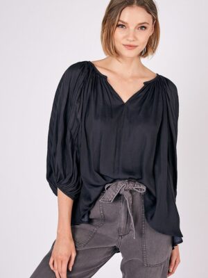 A woman in black Balloon Sleeve Top