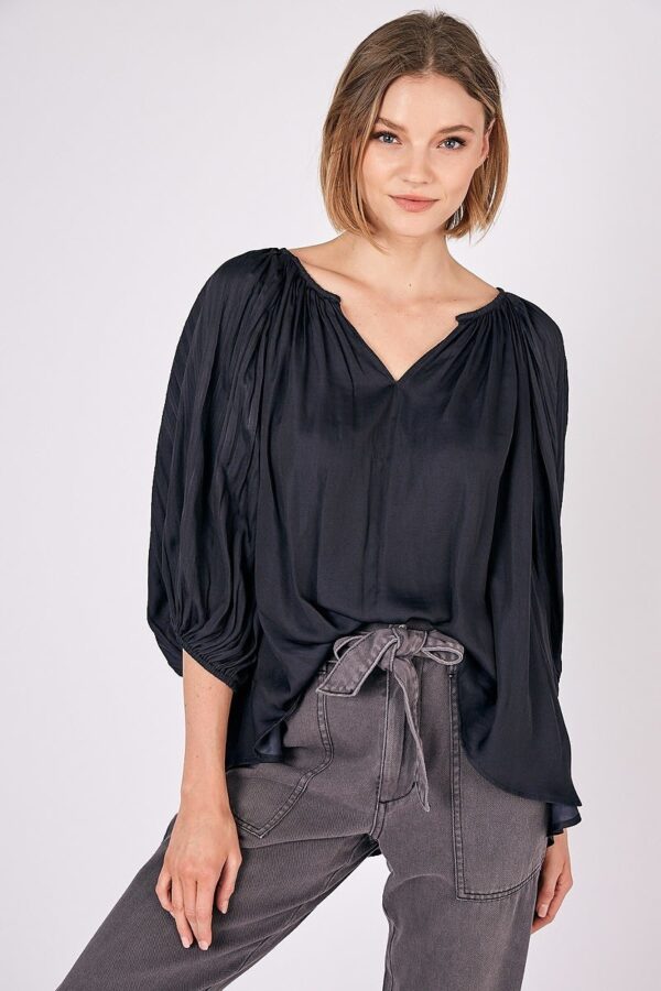 A woman in black Balloon Sleeve Top