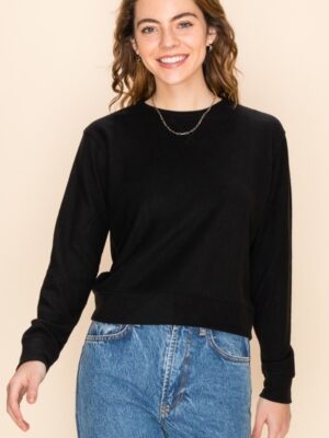 A woman in a black colour Crop sweatshirt Top