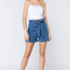 A girl in belted tie pleated denim shorts