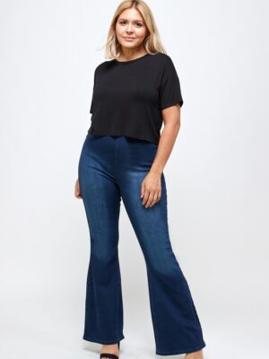 A woman wearing a black tshirt and blue jeans